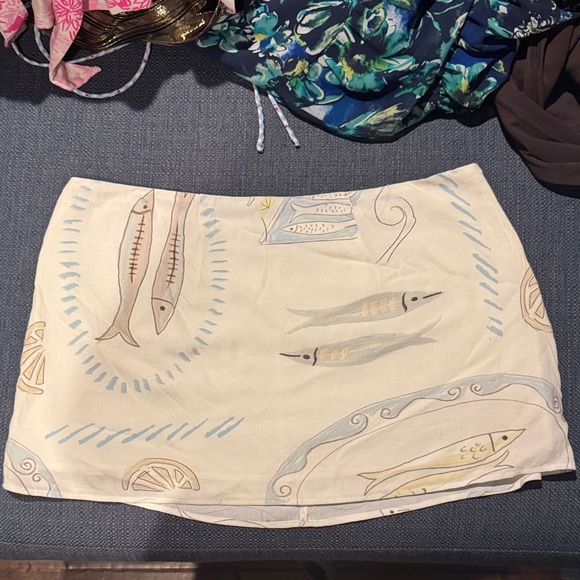 Princess Polly Dresses & Skirts - Princess Polly Cream Mini Skirt with Pastel Fish Print